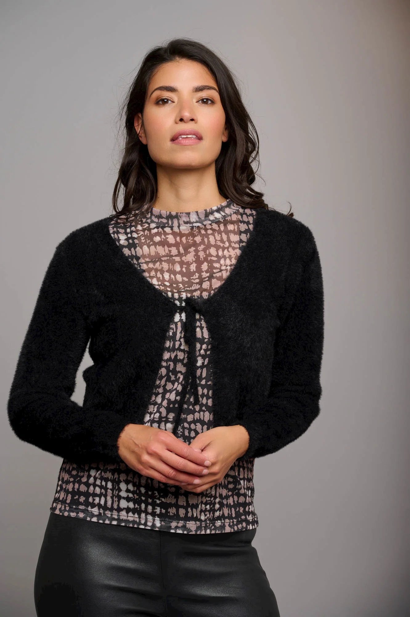 Cropped black long sleeved cardigan with tie fastening