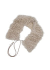 Cream fur scarf with a strap on a white background