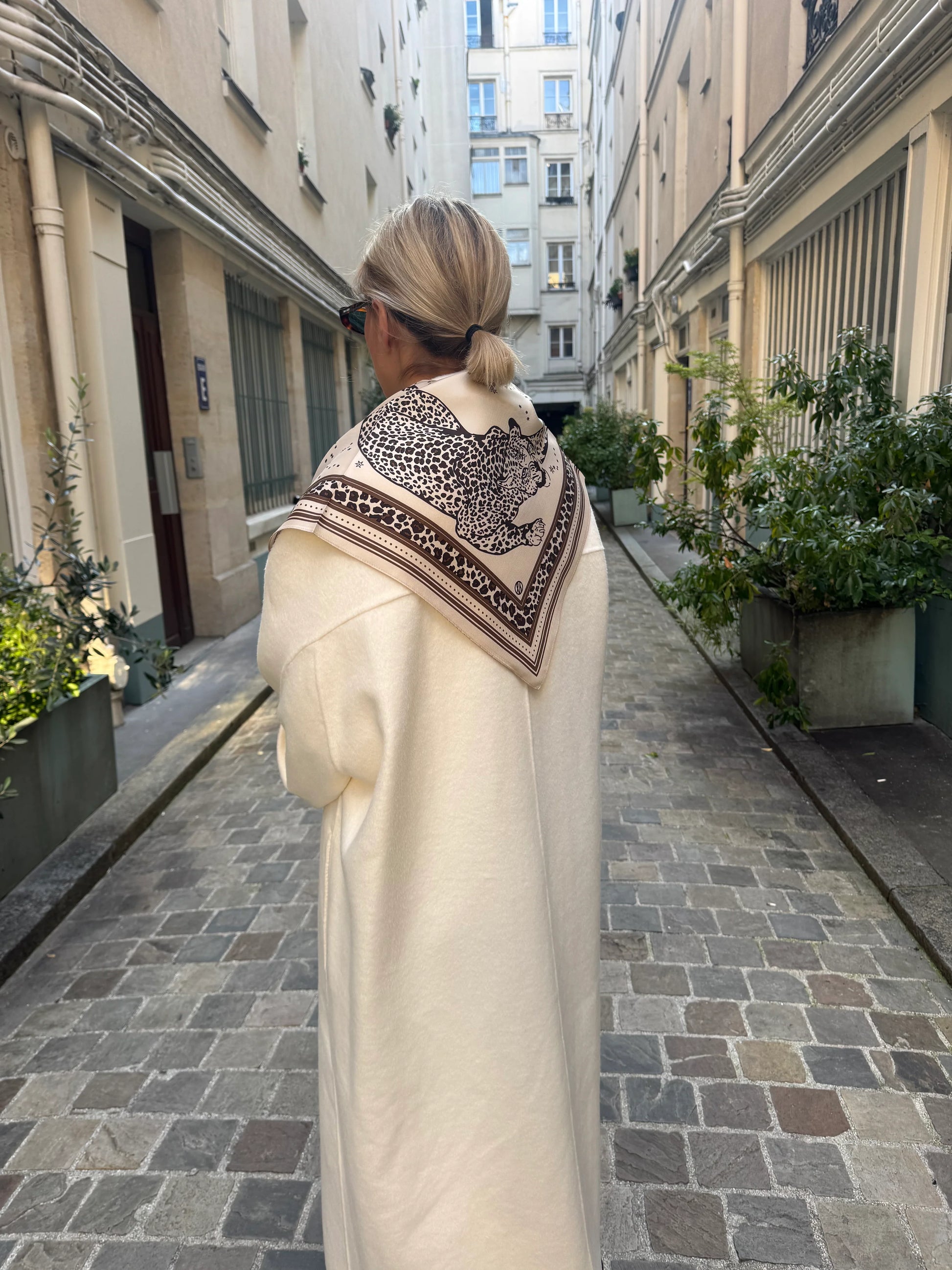 sand coloured silk square scarf with leopard print and zodiak from lescarf model shot