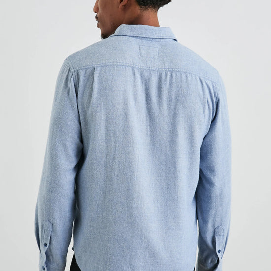 mens blue shirt with chest pocket and curved hem rear view 