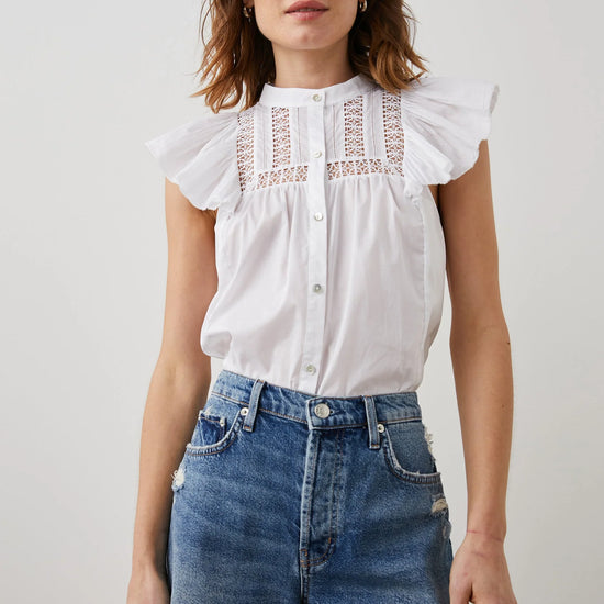 White capped sleeved blouse with lace insert yoke front and rear crew neck and mother of pearly style full length button fastening