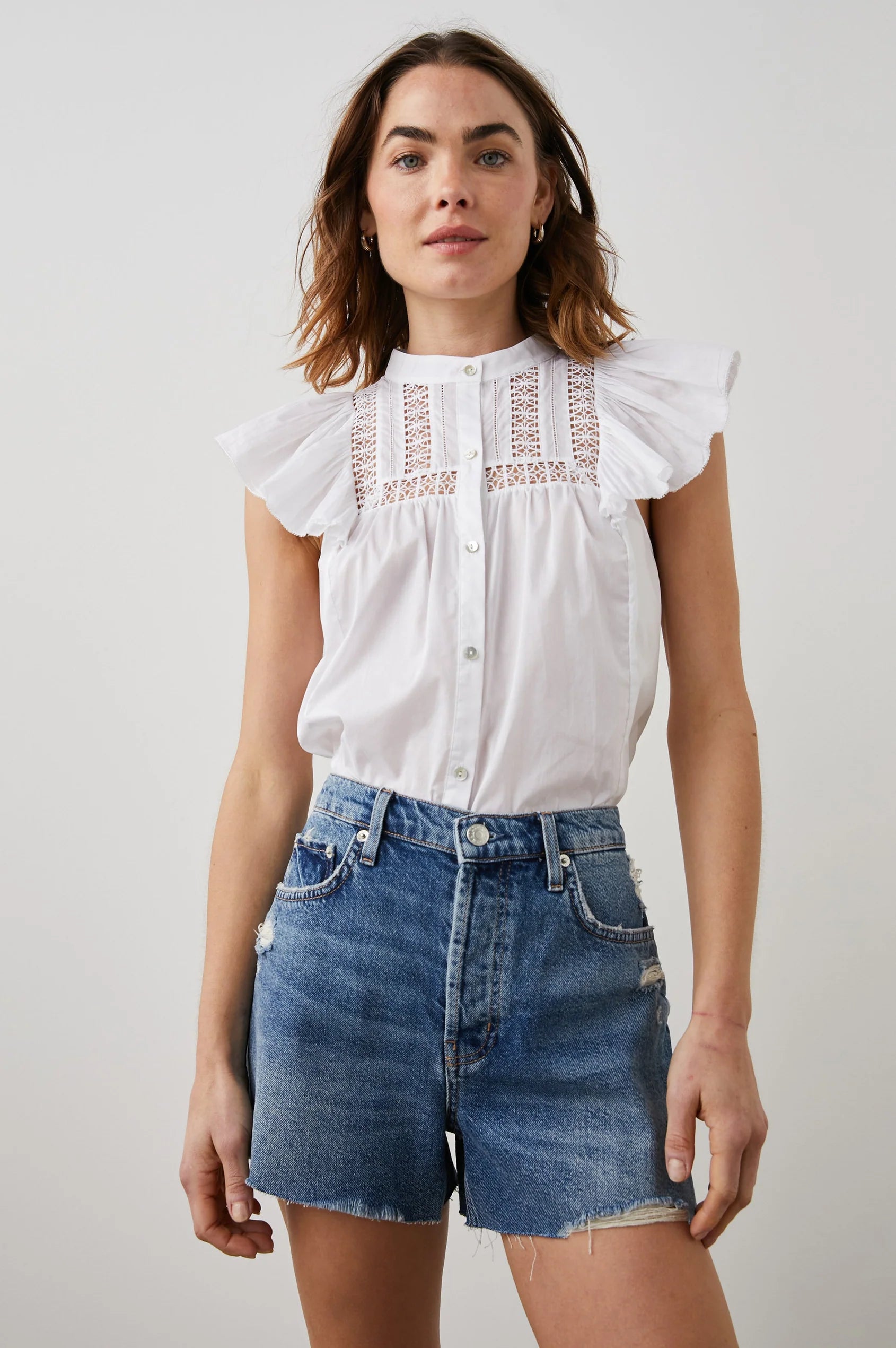 White capped sleeved blouse with lace insert yoke front and rear crew neck and mother of pearly style full length button fastening