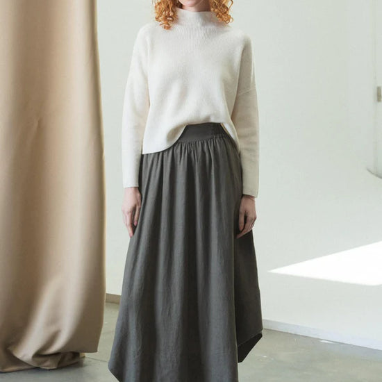 white ribbed jumper with stand neck and long sleeves