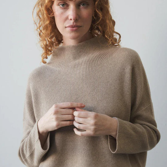 taupe ribbed jumper with stand neck and long sleeves