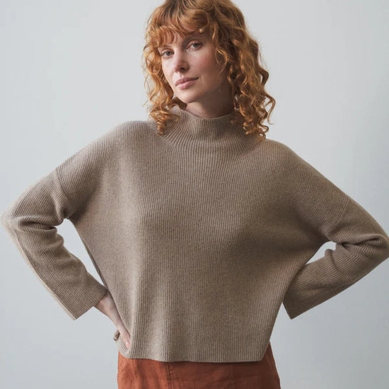 taupe ribbed jumper with stand neck and long sleeves model shot