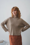 taupe ribbed jumper with stand neck and long sleeves model shot