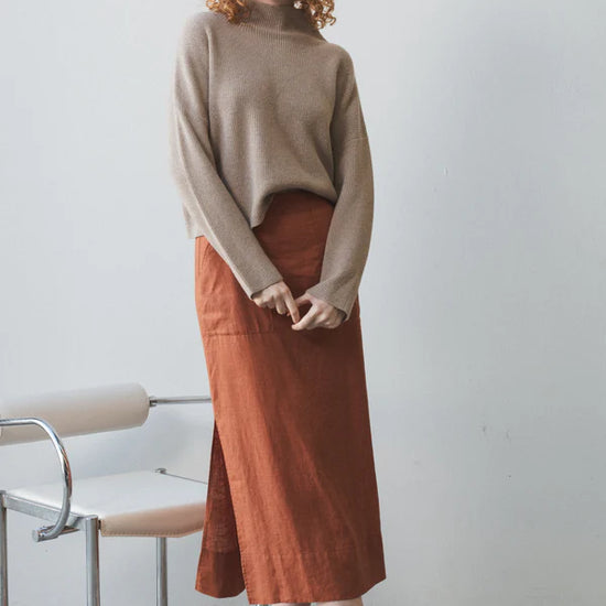 taupe ribbed jumper with stand neck and long sleeves model shot