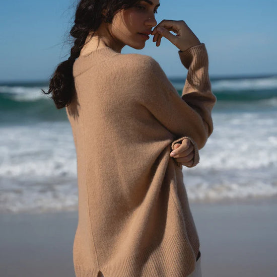 camel cashmere v neck jumper with ribbed neck, cuffs and hem rear view