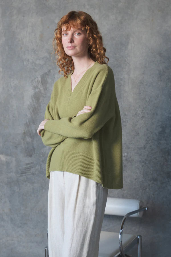 v neck olive cashmere jumper with rib detailing model shot