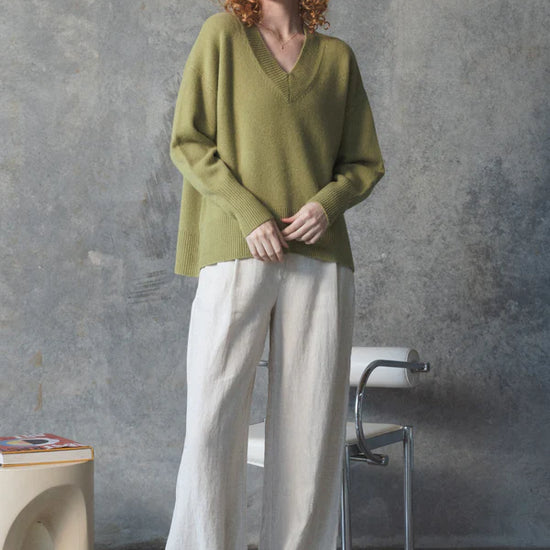 v neck olive cashmere jumper with rib detailing model shot