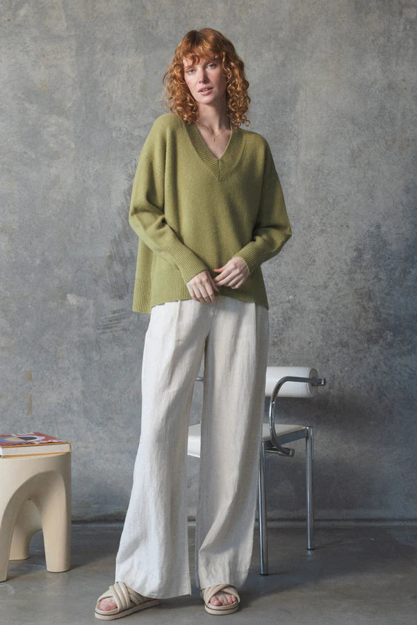 v neck olive cashmere jumper with rib detailing model shot