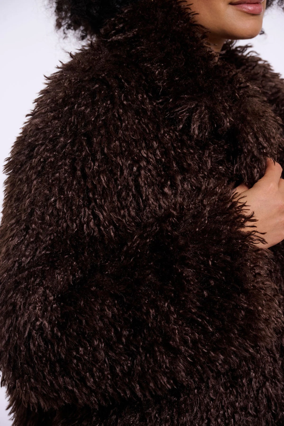 Close-up of a brown fluffy garment with a blurred background