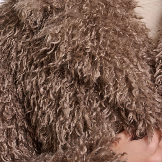 Close-up of a brown fluffy hooded garment