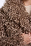 Close-up of a brown fluffy hooded garment