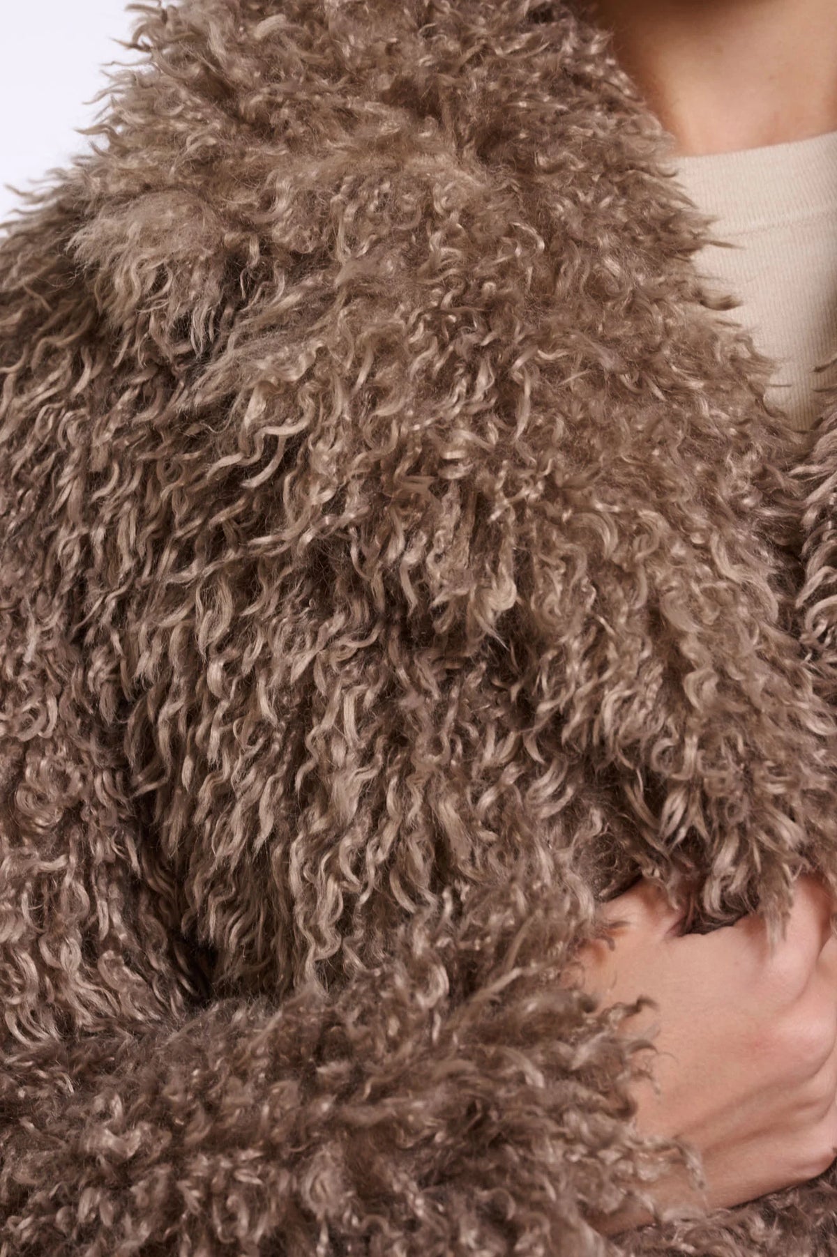 Close-up of a brown fluffy hooded garment