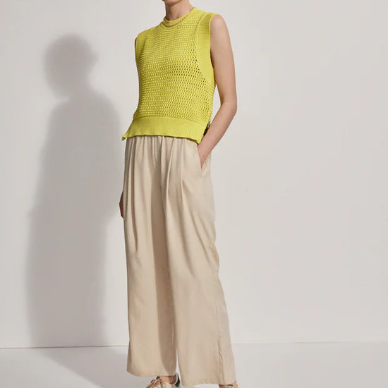 Model wearing loose fitting oyster grey trousers, front view