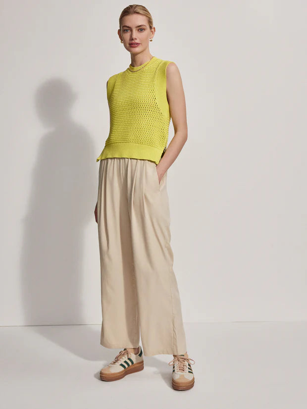 Model wearing loose fitting oyster grey trousers, front view