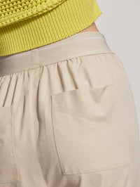 Close up of oyster grey trousers rear pocket and waistband