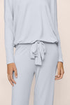 Light blue long-sleeve top and pants set on a beige background