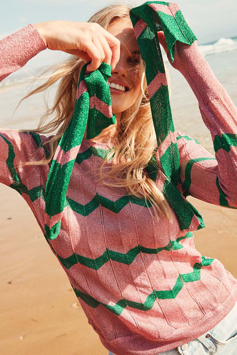 Pink crew neck long sleeved top with green chevron in sparkle material with slim scarf