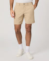 Person wearing beige shorts on a plain background from Paige