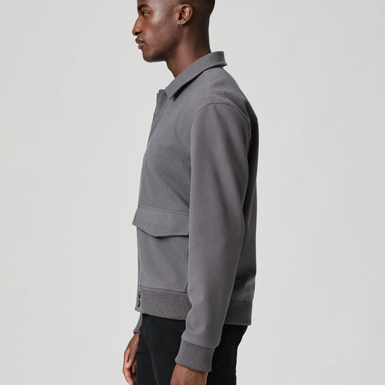 grey mens jacket with collar, 2 flap pockets and concealed placket from paige side view