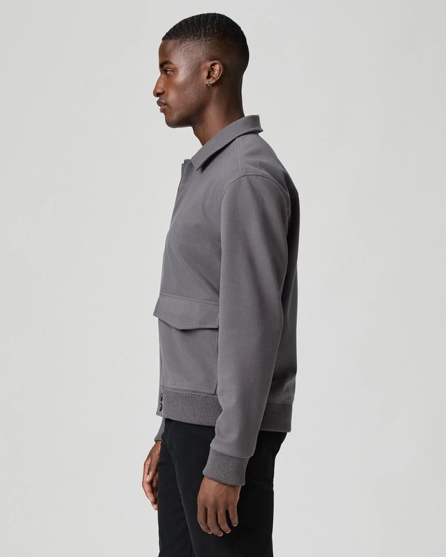 grey mens jacket with collar, 2 flap pockets and concealed placket from paige side view