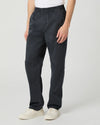 Man wearing navy trousers on white background