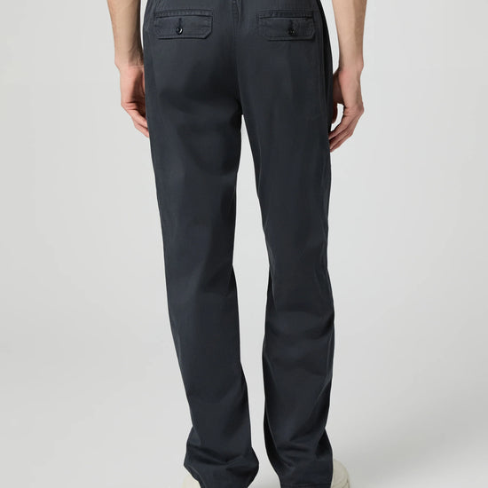 Person wearing black pants on a white background