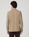 Man wearing beige polo rear view