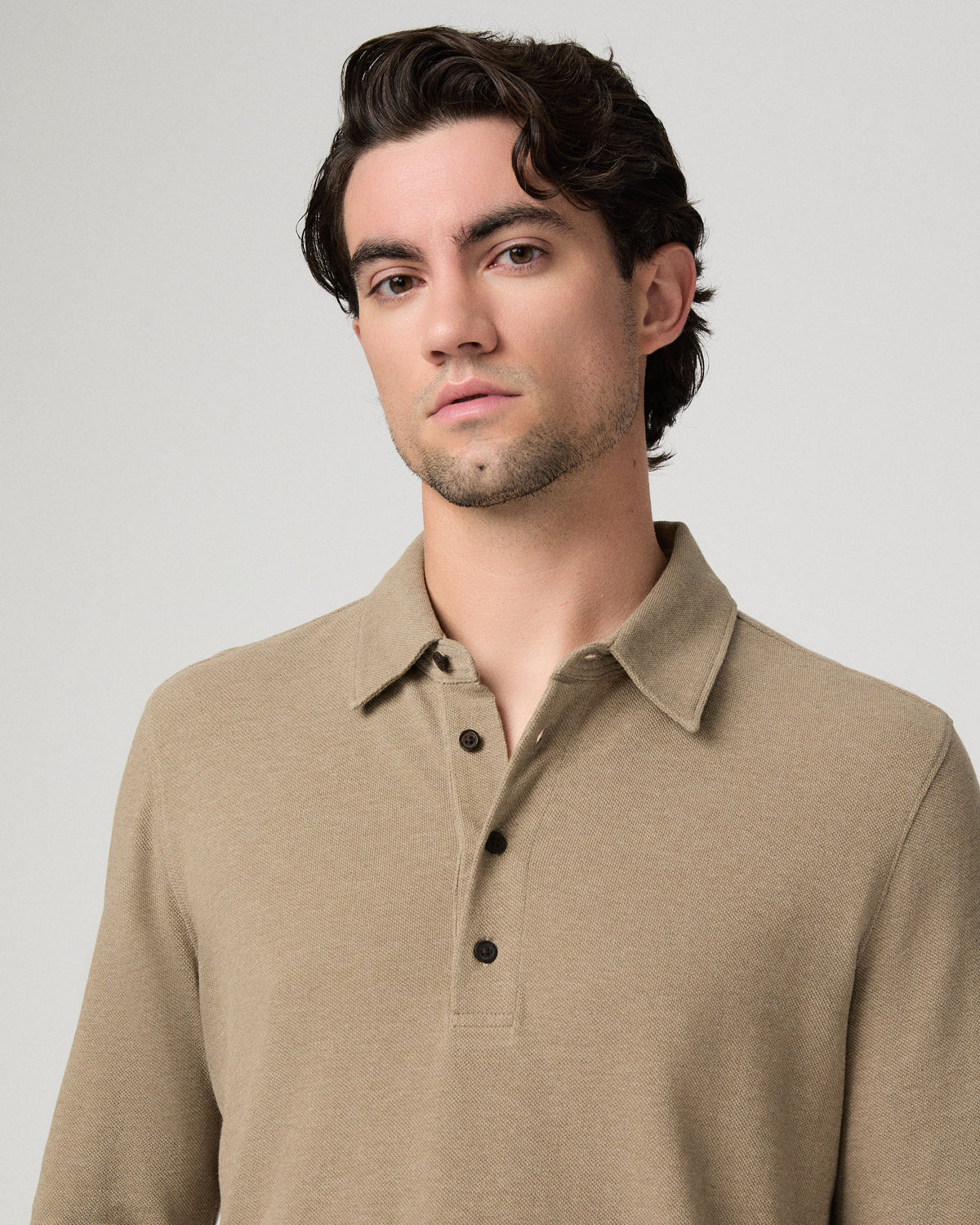 Man wearing beige polo close up