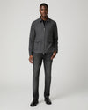 Man wearing grey zip jacket and black jeans  full outfit 