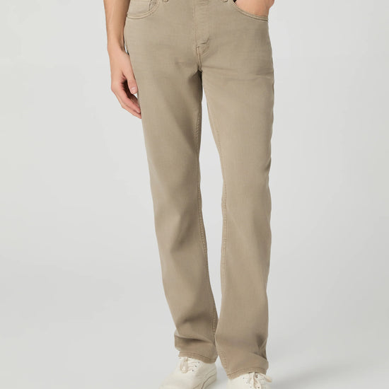 Person wearing beige pants on a white background from Paige
