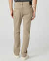 Beige pants worn by a person on a light gray background from paige
