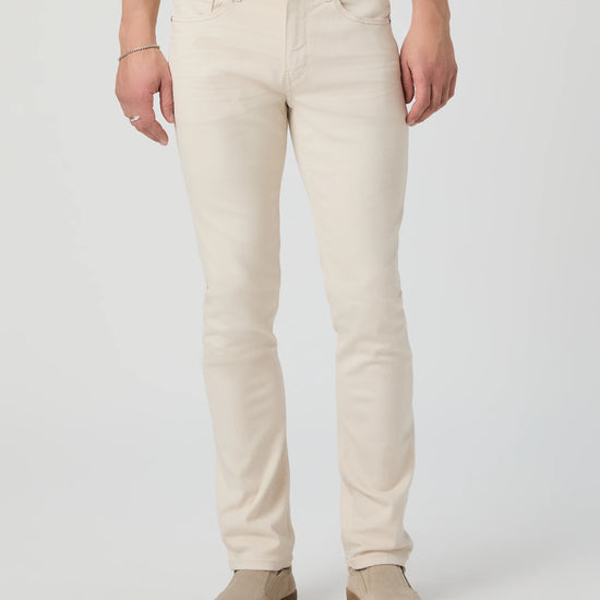 Person wearing beige pants on a white background from Paige