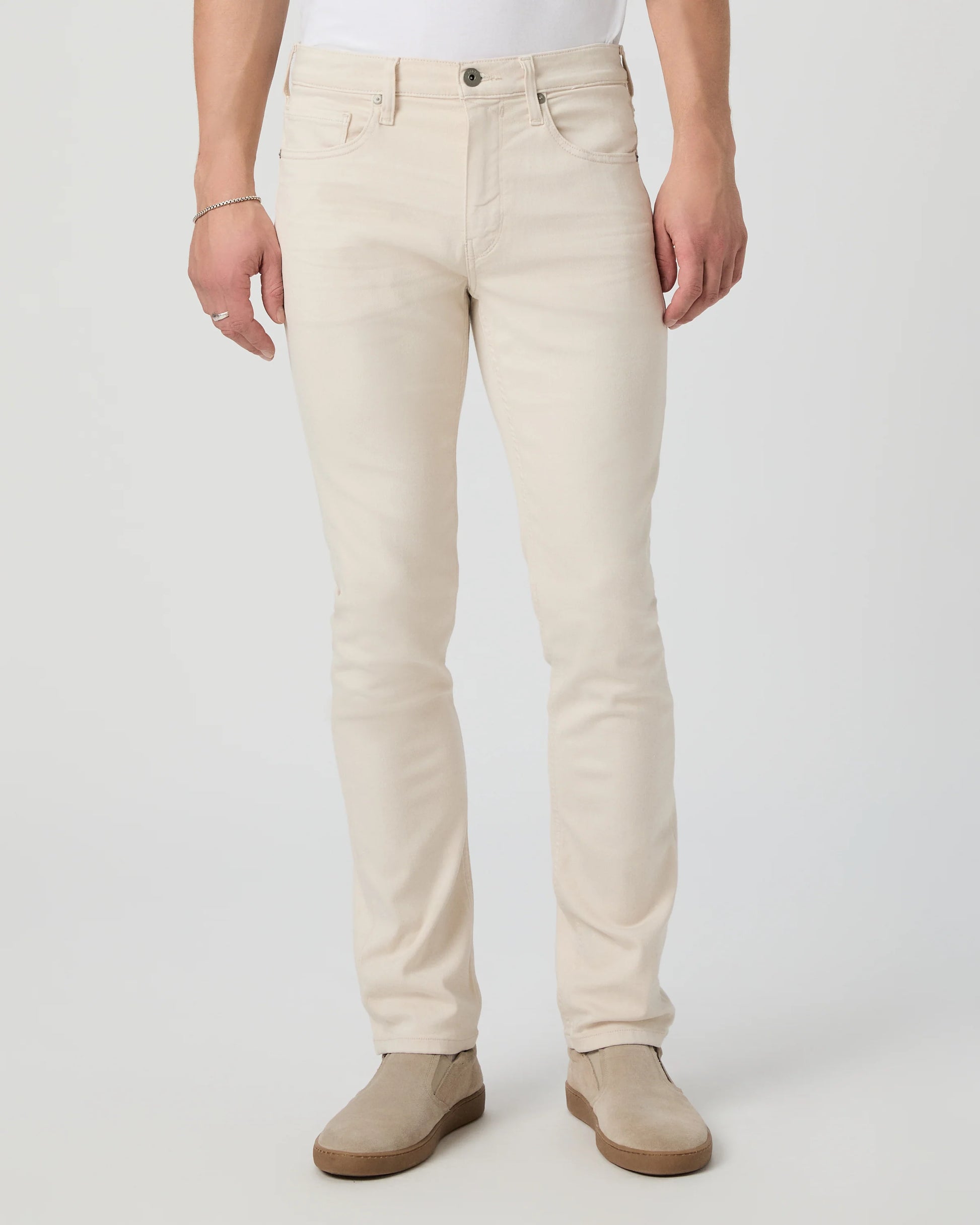 Person wearing beige pants on a white background from Paige