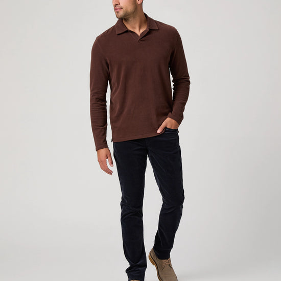 navy blue micro corduroy slim straight leg jeans with metallic hardware from paige model shot