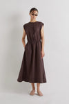 Woman wearing a brown linen dress against a plain background from Mei MeiJ