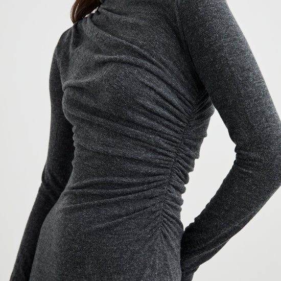 dark grey body con dress with ruching details and long sleeves side view