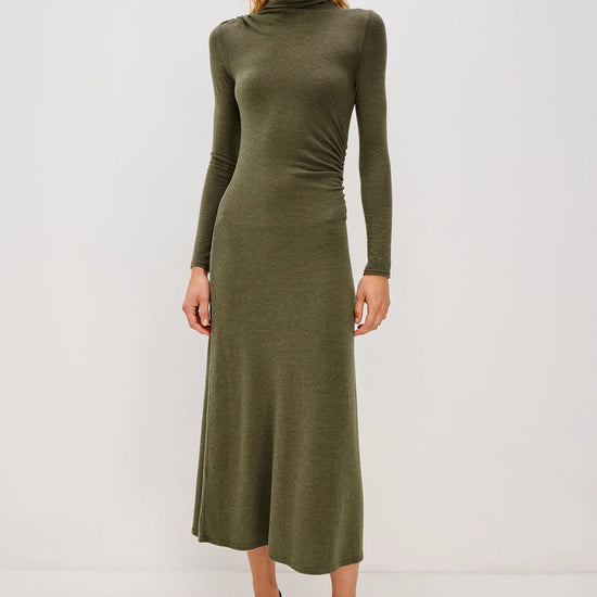olive green bodycon dress with rouche detailing and mid length with long sleeves model shot 