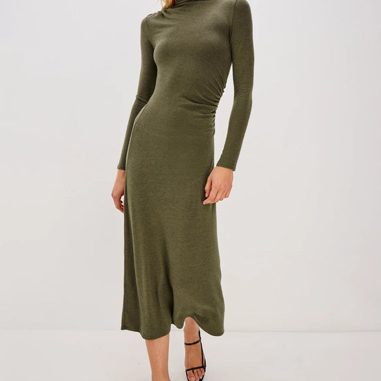 olive green bodycon dress with rouche detailing and mid length with long sleeves model shot