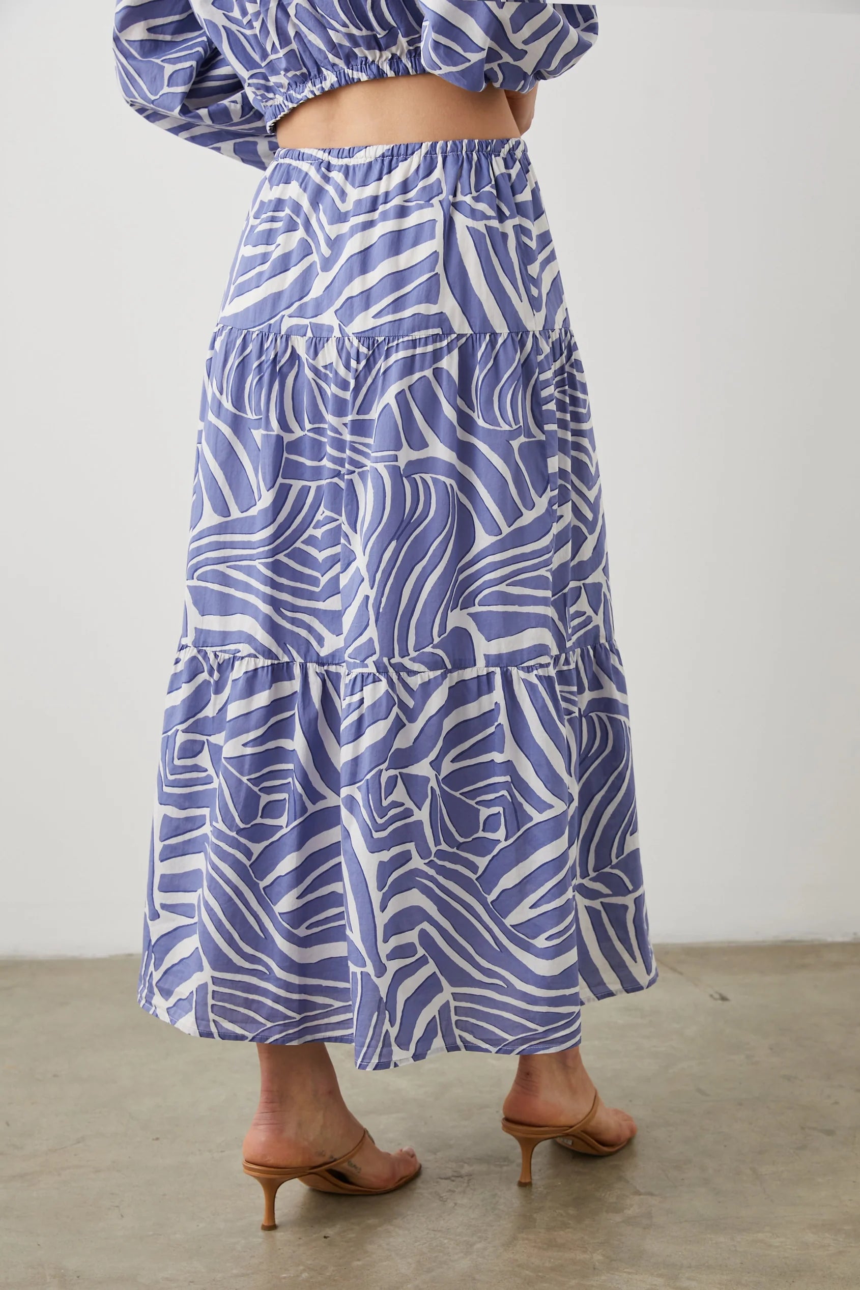 Midi skirt with white and cornflower blue geometric pattern fully lined with triple tiers