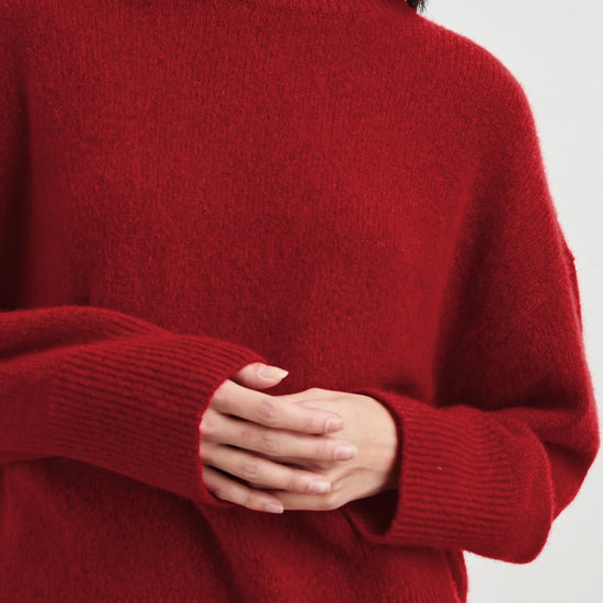 Close up of red cashmere and silk blend knit