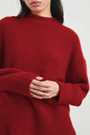 Close up of red cashmere and silk blend knit