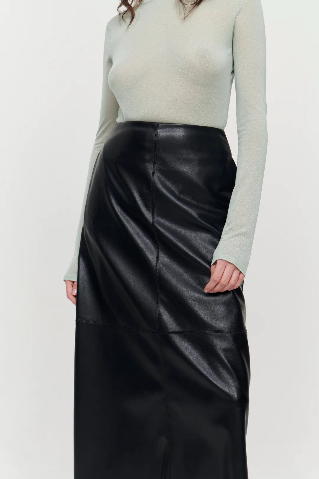A line midi vegan leather black skirt with panel features and a centre back zip fastening with inseam side pockets