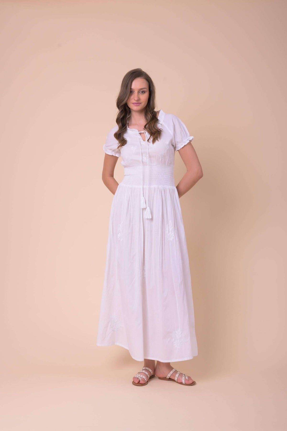 White cotton dress with a shirred waist detail and short sleeves