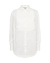 A white long-sleeve button-up shirt with a textured, vertically pleated yoke on the chest, displayed on a clean white background.