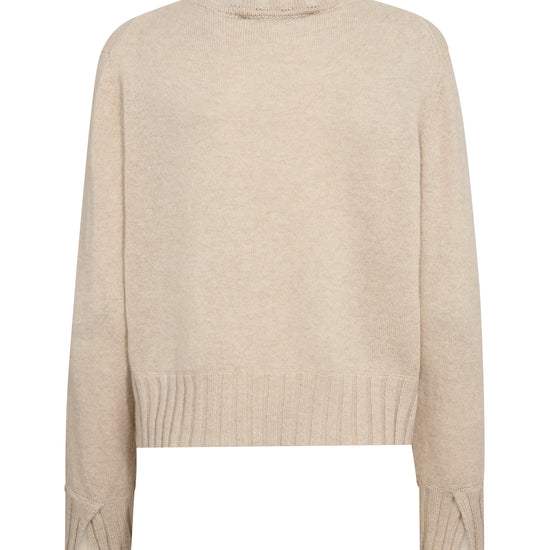 A light beige knit sweater with long sleeves and ribbed cuffs, displayed against a plain white background.