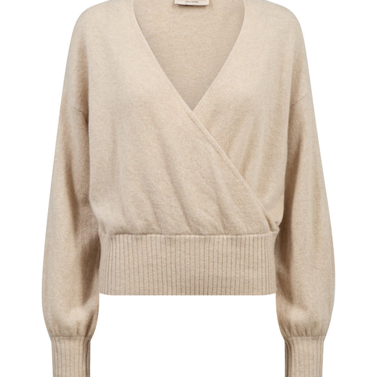 A light beige knit wrap sweater with a V-neckline, long sleeves, and ribbed cuffs and hem, shown against a plain white background.