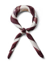 Scarf twisted into a knot on a white background